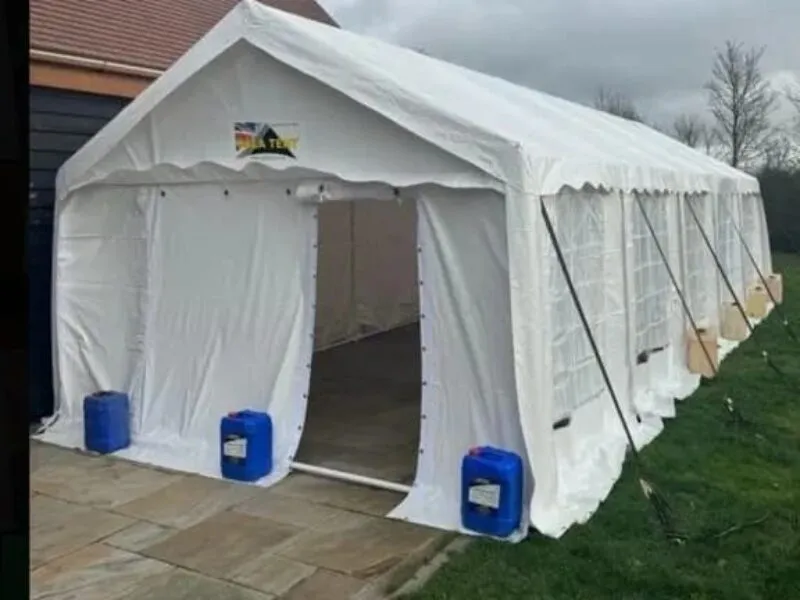 Marquee Exterior Setup For Private Event Hire White marquee exterior setup with open entrance ready for private event