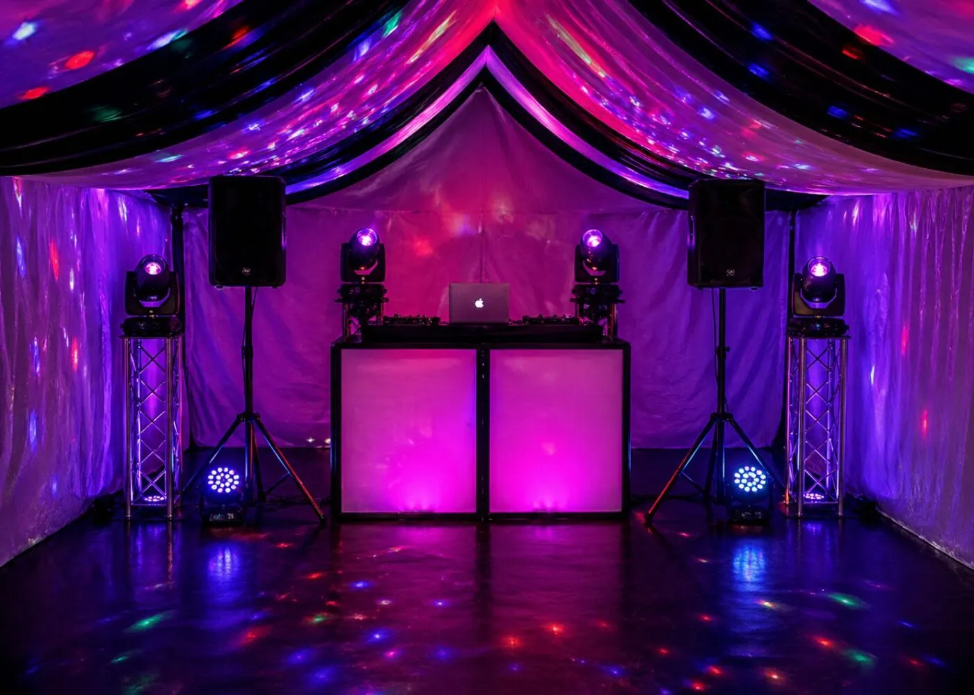 DJ Hire Essex – Marquee DJ Setup with Lighting and Speakers DJ hire setup in Essex marquee with speakers, lighting and DJ booth for weddings and events