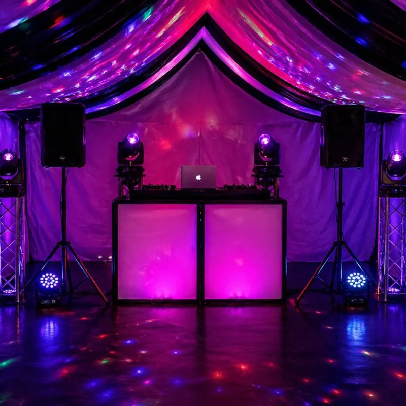 DJ Hire Essex – Marquee DJ Setup with Lighting and Speakers DJ hire setup in Essex marquee with speakers, lighting and DJ booth for weddings and events