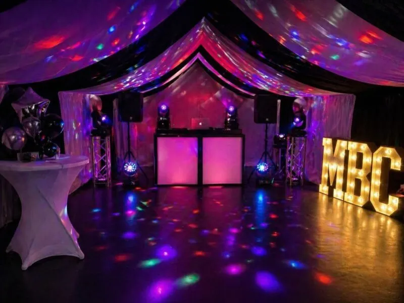 DJ Hire Essex – Marquee Party DJ and Lighting Setup DJ hire setup in Essex marquee with lighting, speakers and illuminated letters for party event