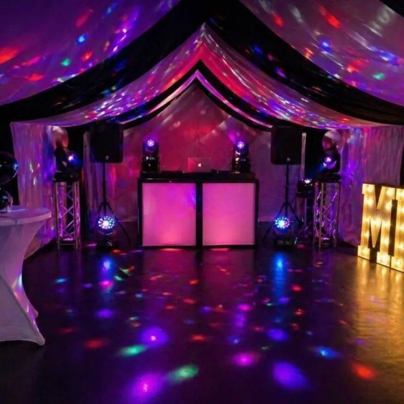 DJ Hire Essex – Marquee Party DJ and Lighting Setup DJ hire setup in Essex marquee with lighting, speakers and illuminated letters for party event