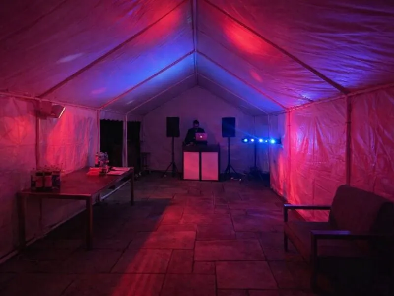 DJ Hire Setup in Marquee with Lighting and Sound DJ hire setup inside a marquee with lighting and sound system for events