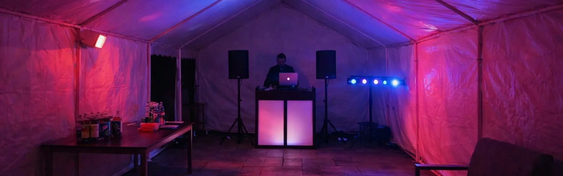 DJ Hire Marquee Party Lighting and Sound Setup DJ hire in Essex marquee with lighting, speakers and DJ booth for party events