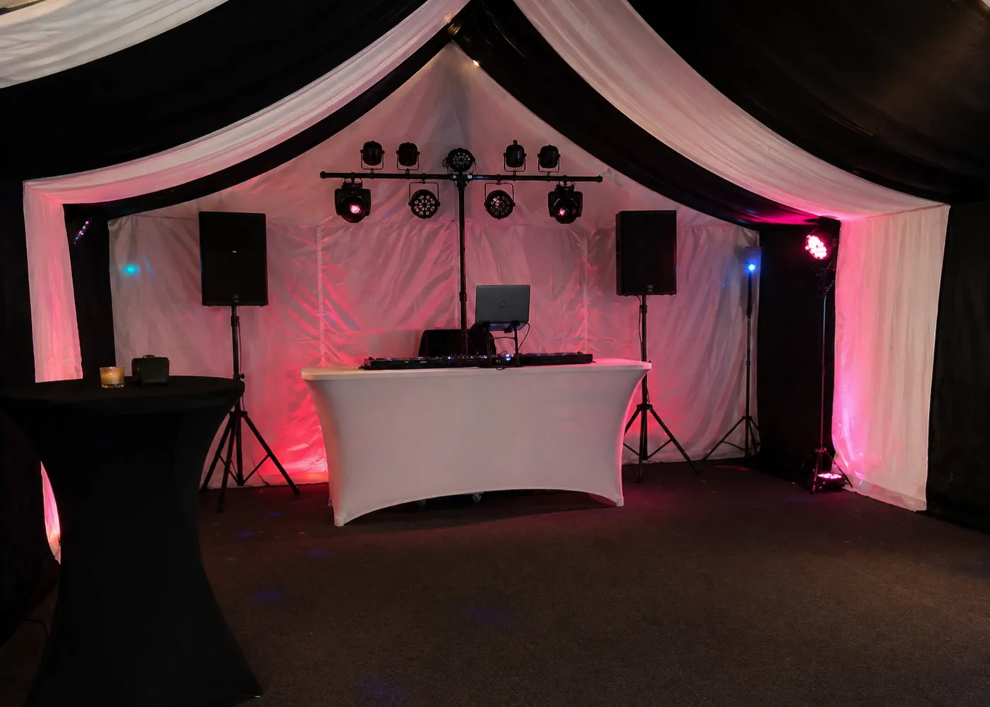 DJ Setup Essex – Layout and Event Planning Inside Marquee DJ setup in Essex marquee showing speakers, lighting rig and DJ booth arranged for event layout and planning
