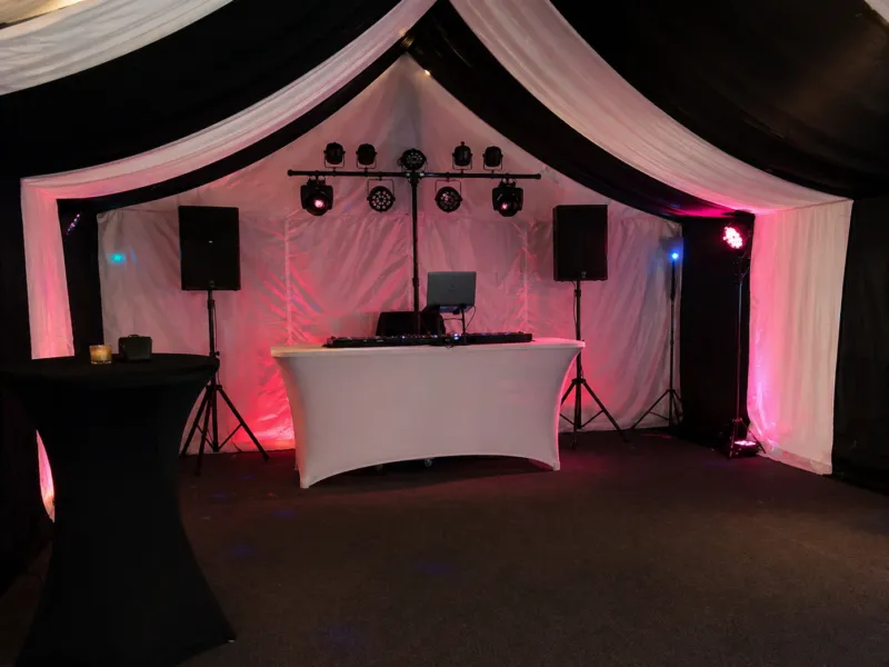 DJ Setup Essex – Layout and Event Planning Inside Marquee DJ setup in Essex marquee showing speakers, lighting rig and DJ booth arranged for event layout and planning