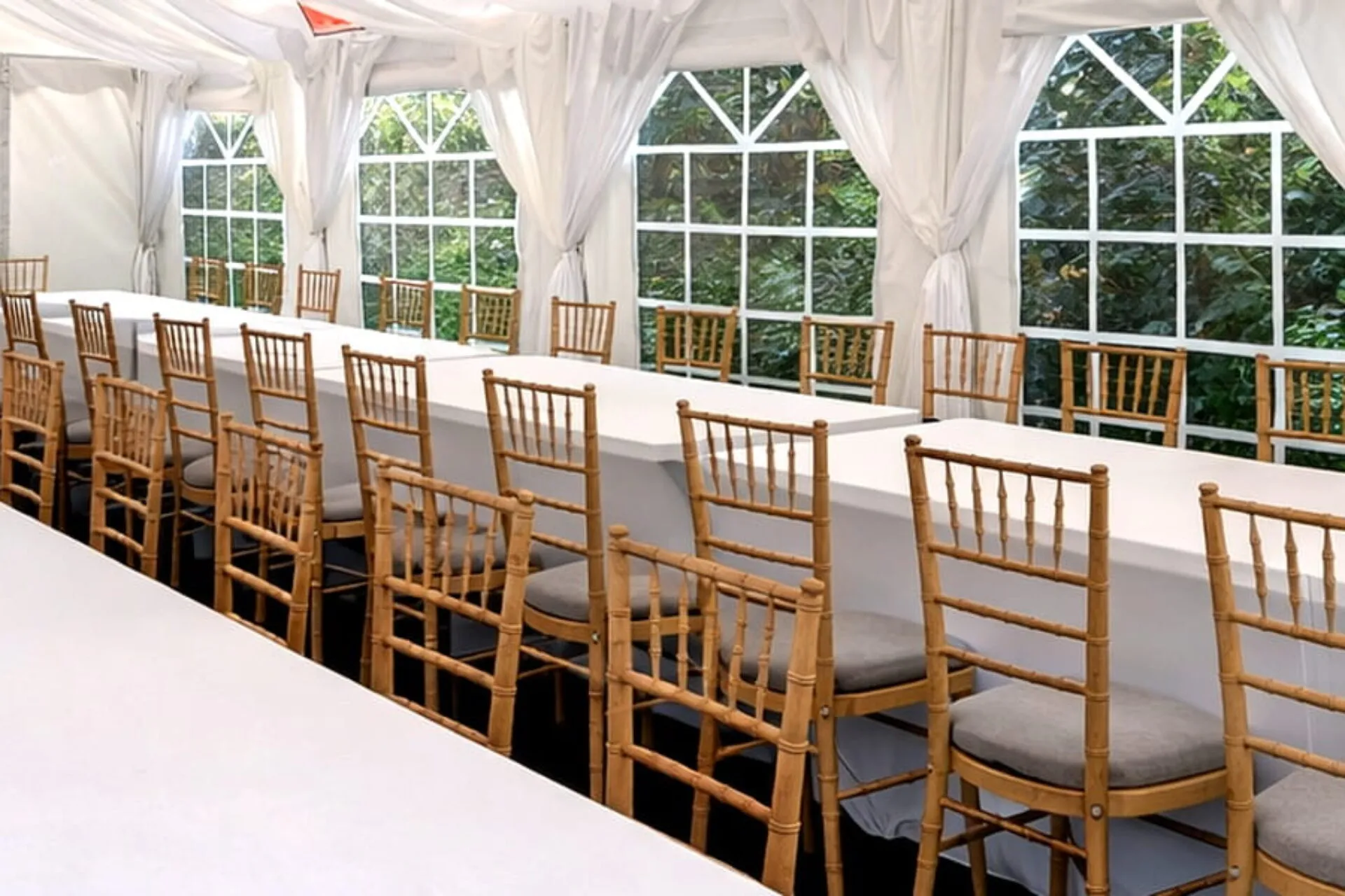 Furniture Hire Long Table And Chair Layout Marquee interior with long tables and Chiavari chairs arranged for furniture hire setup