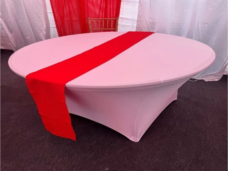 Table Runner Detail – Forest Gate Marquee Setup Round table with white cover and red runner inside marquee in Forest Gate during event setup