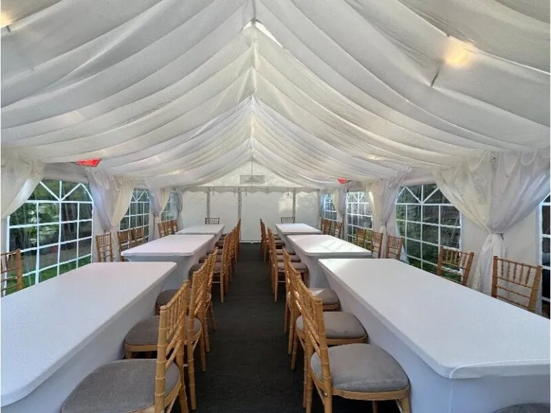 Marquee Interior Long Table Setup – Tilbury Garden Event 4m x 8m marquee interior with long table layout and Chiavari chairs for garden party in Tilbury