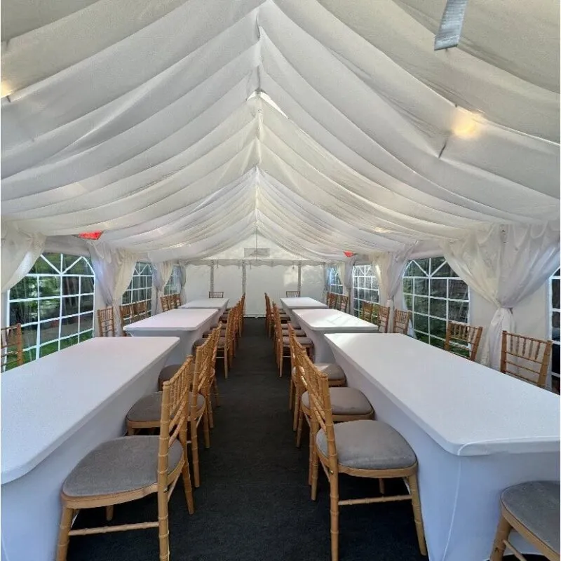 Marquee Interior Long Table Setup – Tilbury Garden Event 4m x 8m marquee interior with long table layout and Chiavari chairs for garden party in Tilbury