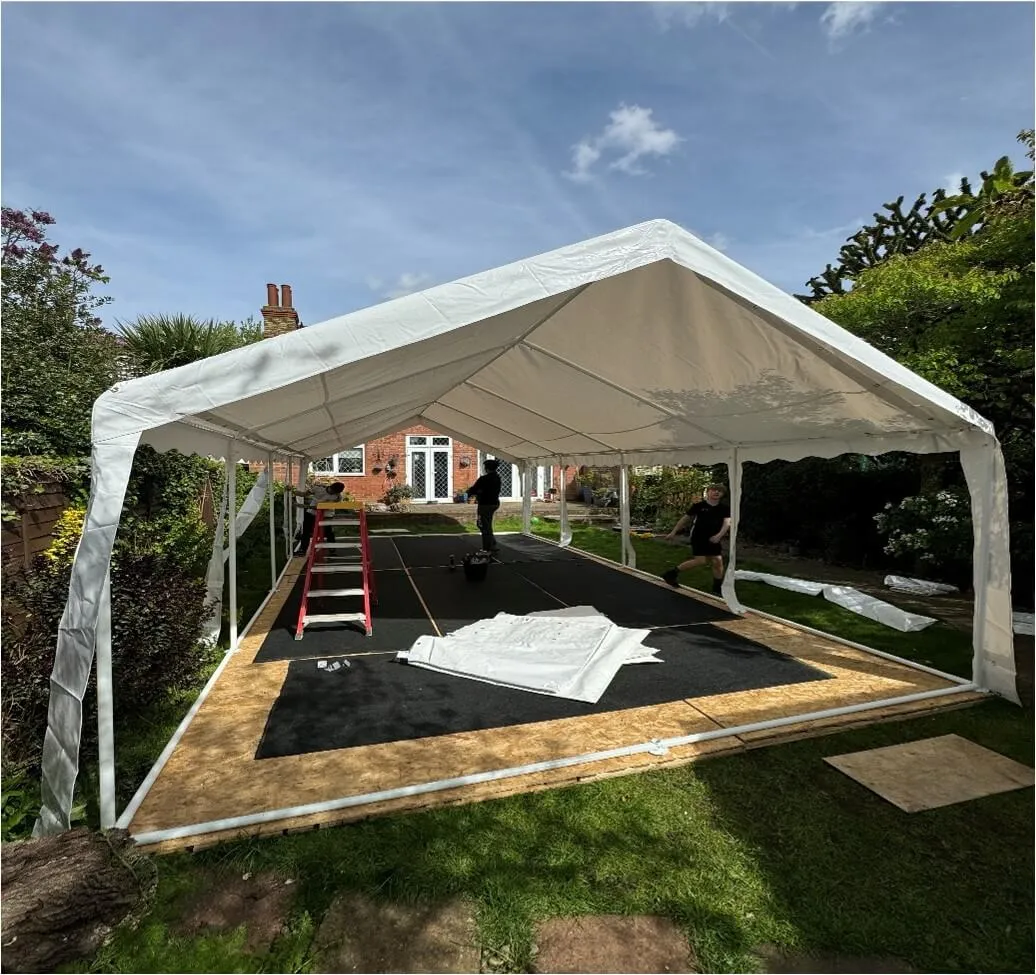 Marquee Structure Installation – Tilbury Garden Setup 4m x 8m marquee structure assembled in Tilbury garden during installation with flooring and frame in place
