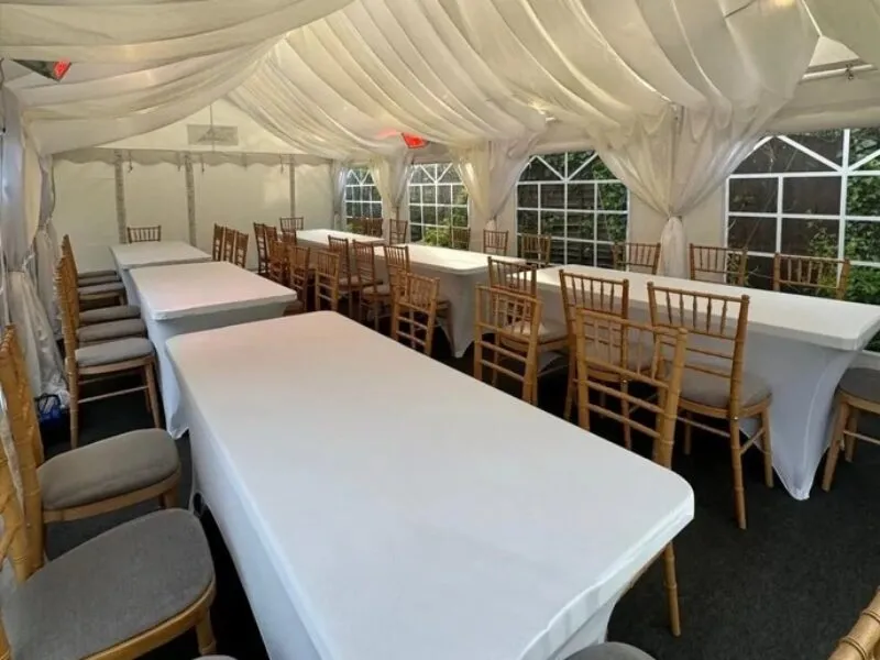Chair Hire Essex – Event Seating Layout with Chiavari Chairs Limewash Chiavari chair hire in Essex arranged in long table seating layout inside marquee