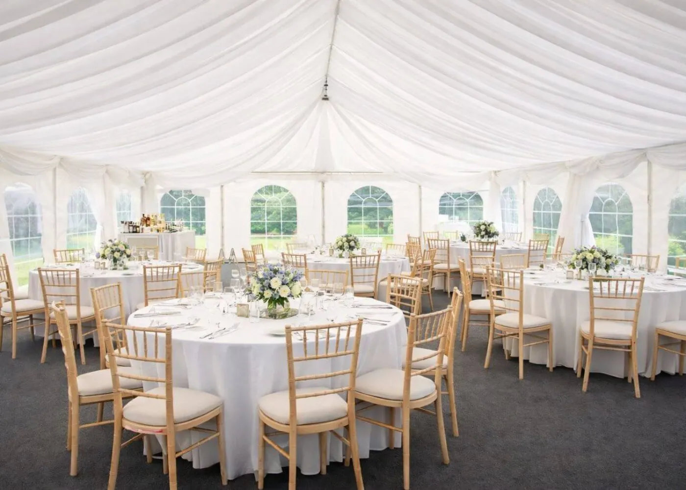 Marquee Event Setup For Quote And Planning Marquee interior with round tables and chairs arranged for event planning and hire
