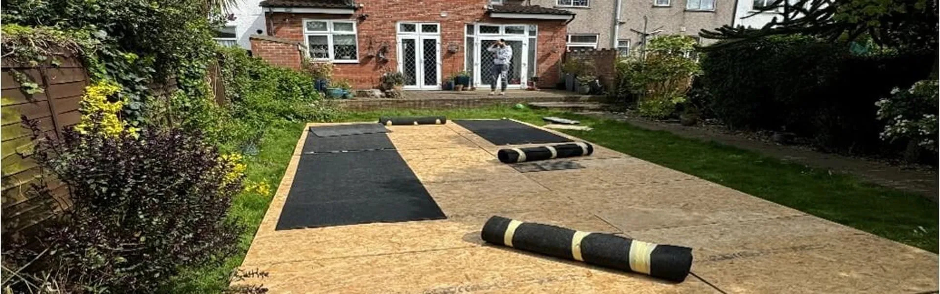 Marquee Setup Essex – Flooring Installation and Event Preparation Marquee flooring installation in Essex garden showing event setup preparation and ground levelling for marquee hire