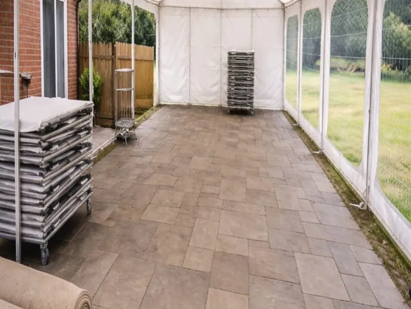 Marquee Flooring Setup Essex – Event Preparation and Installation Marquee setup in Essex showing flooring installation and stacked equipment ready for event preparation