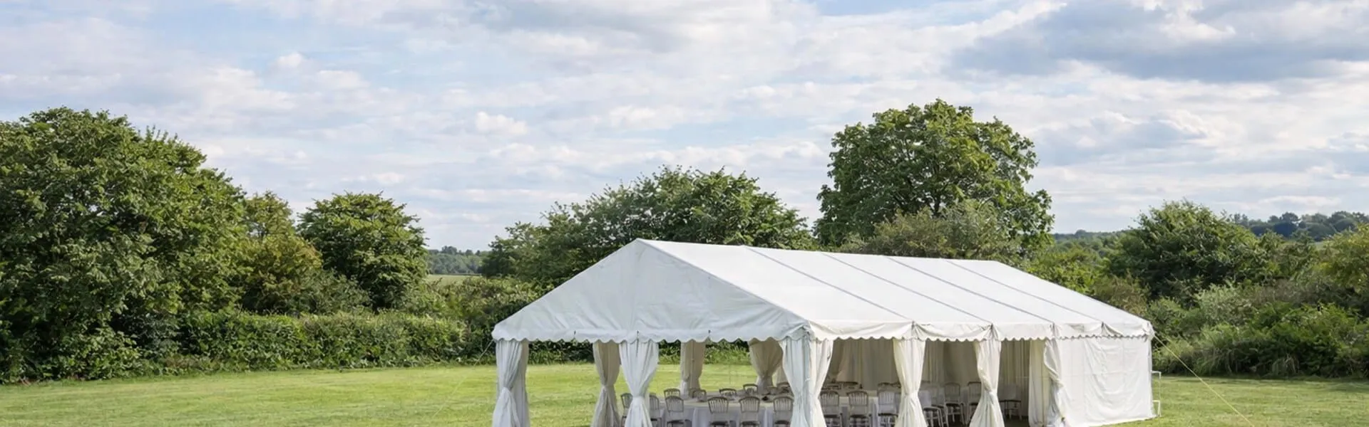 Marquee setup in open garden setting showing event hire coverage across Essex and surrounding areas Marquee setup in open garden setting showing event hire coverage across Essex and surrounding areas