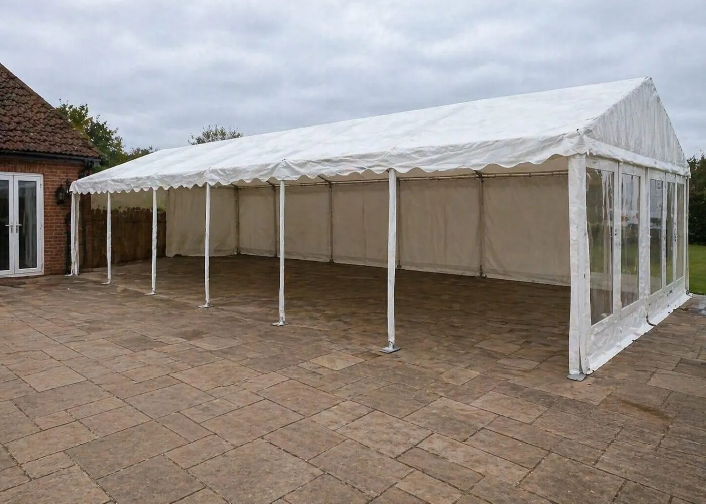 Marquee setup exterior with flooring on patio area for event hire