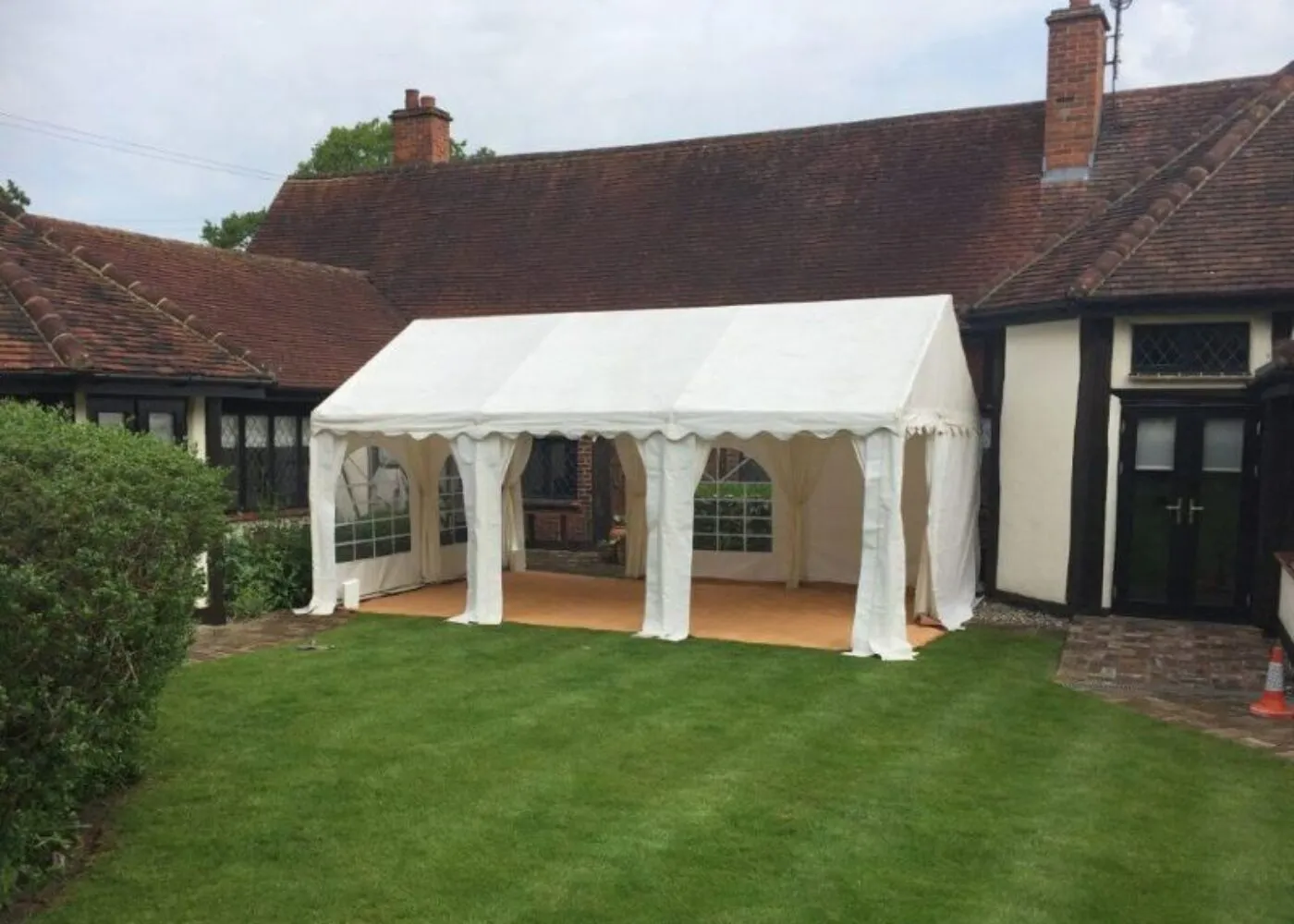 Marquee Hire Essex – Structure and Flooring Setup Marquee hire setup in Essex showing structure and flooring installation for private event