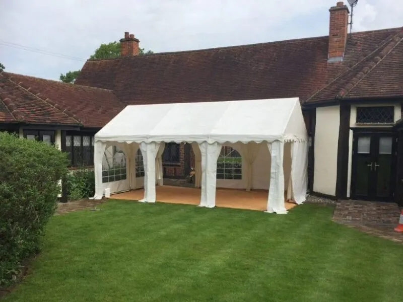 Marquee Hire Essex – Structure and Flooring Setup Marquee hire setup in Essex showing structure and flooring installation for private event