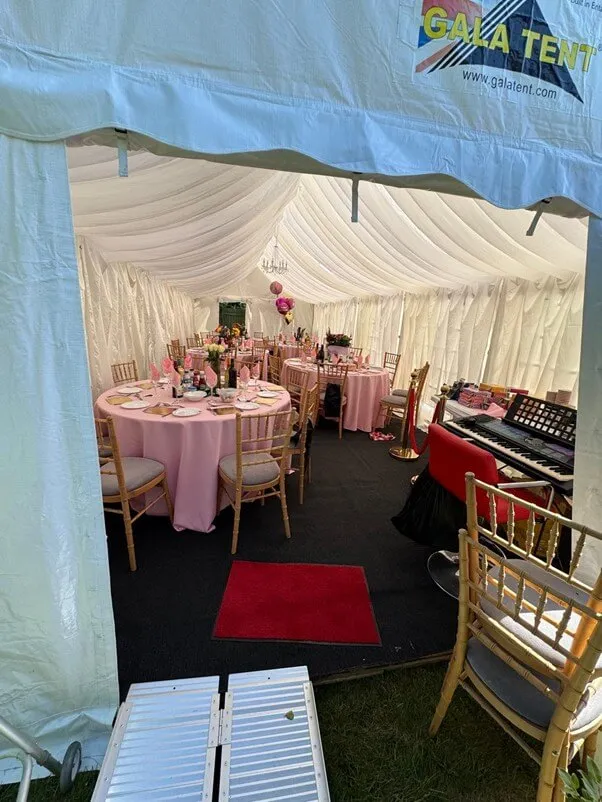 Hainault Marquee Interior Entrance View Marquee interior setup in Hainault with dining tables, chairs and event layout viewed from entrance
