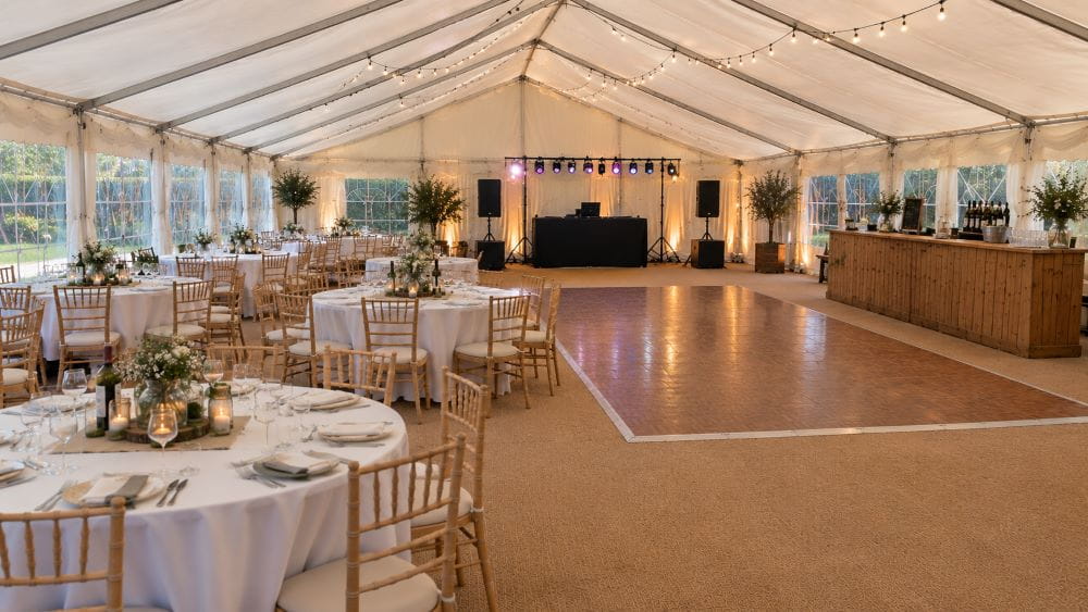 Marquee layout with dining area, dance floor, DJ and bar zones