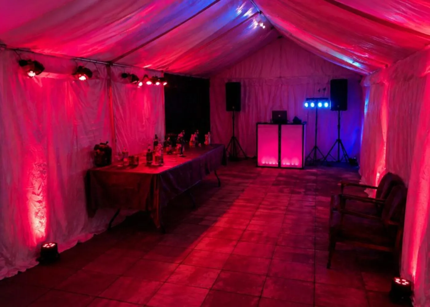 Speaker Hire Essex – Party Audio and Lighting Setup Speaker and PA system setup in Essex with DJ booth, lighting and event layout inside marquee for private party