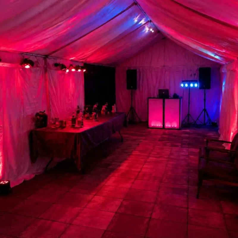 Speaker Hire Essex – Party Audio and Lighting Setup Speaker and PA system setup in Essex with DJ booth, lighting and event layout inside marquee for private party