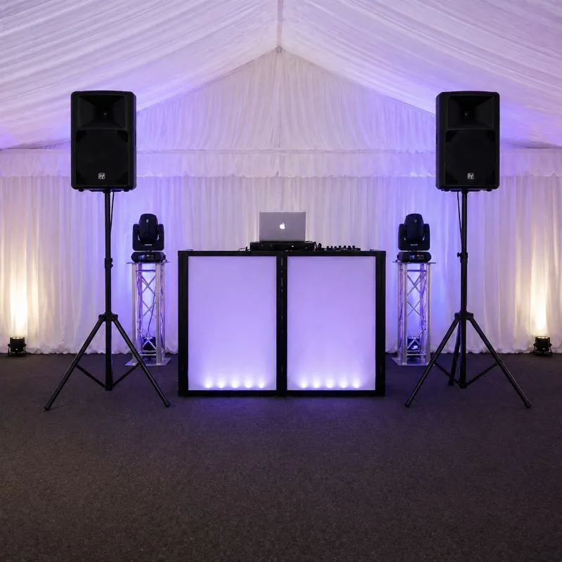Speaker Hire Essex – Additional Audio Setup and PA System Layout Speaker and PA system setup in Essex with DJ booth and lighting inside marquee showing clean event audio layout
