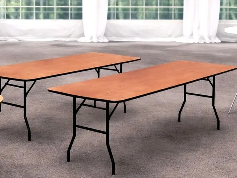 Trestle Table Hire for Events Trestle table hire in Essex showing rectangular event table inside a marquee