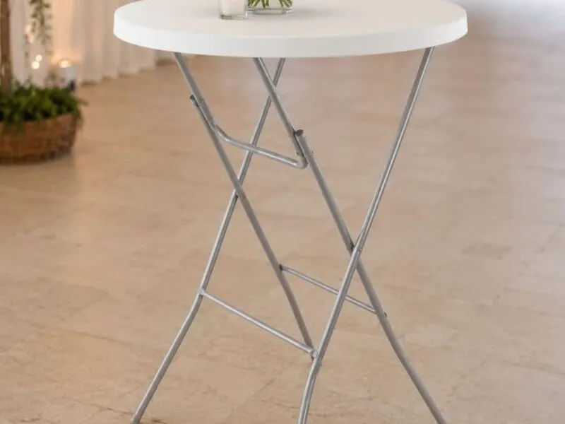 White cocktail table set up inside an event space, suitable for drinks areas, standing receptions, parties and marquee events.