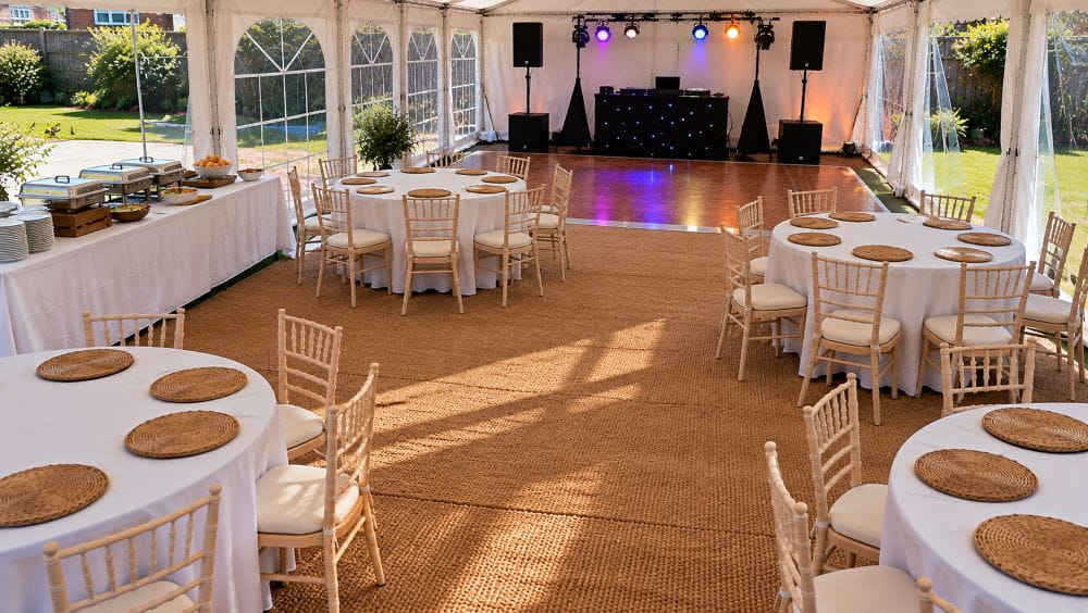 Garden marquee layout with dining, food service and separate entertainment areas